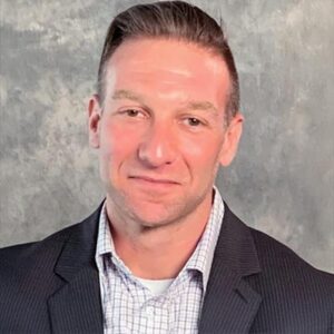 Eric Lewy, white man with short hair and blue suit jacket